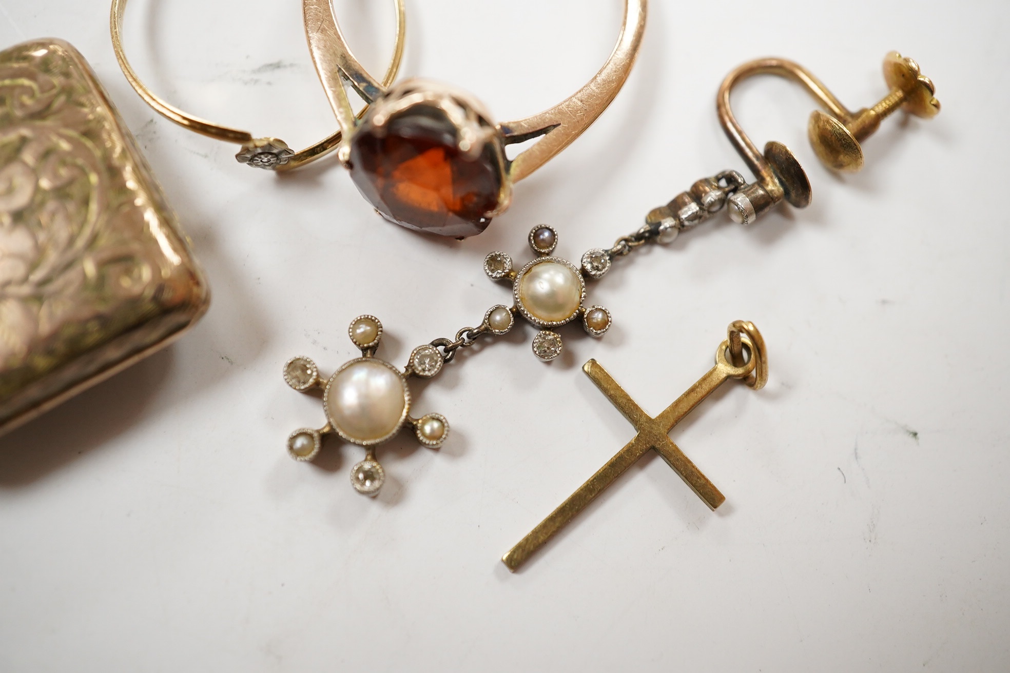 Sundry jewellery including a yellow metal and hessonite garnet set ring, a single yellow metal, seed pearl and diamond cluster set drop earring, locket, cross and a ring. Condition - poor to fair